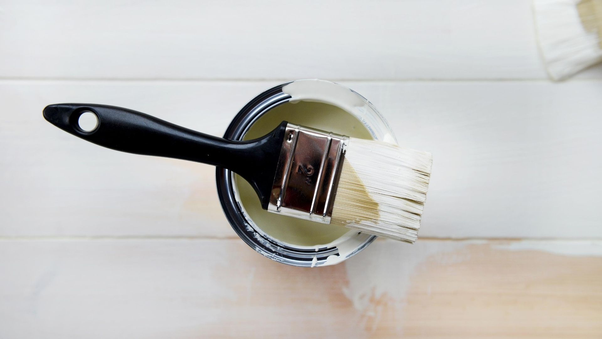 paint and paint bucket on floor