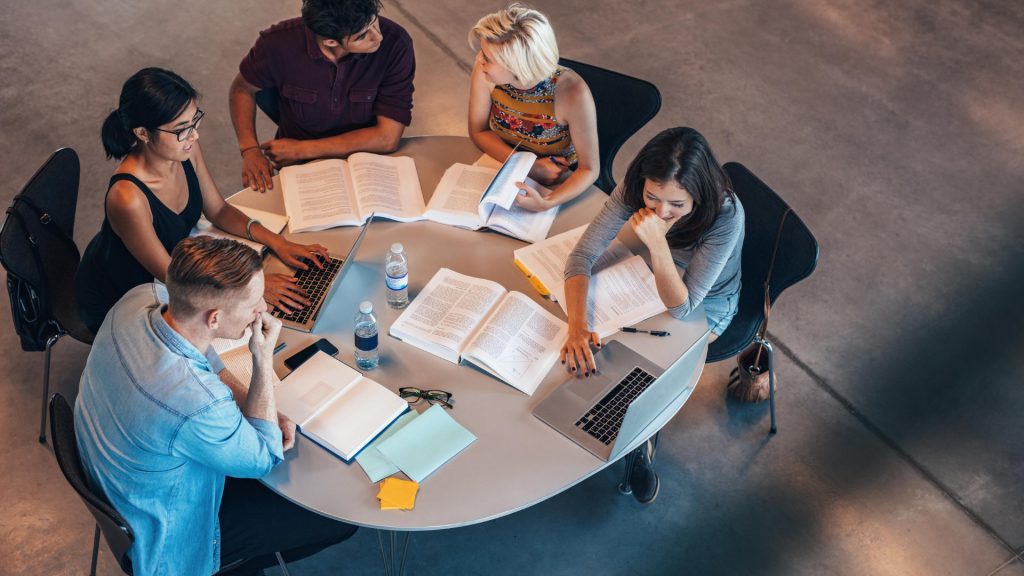 students at a desk studying